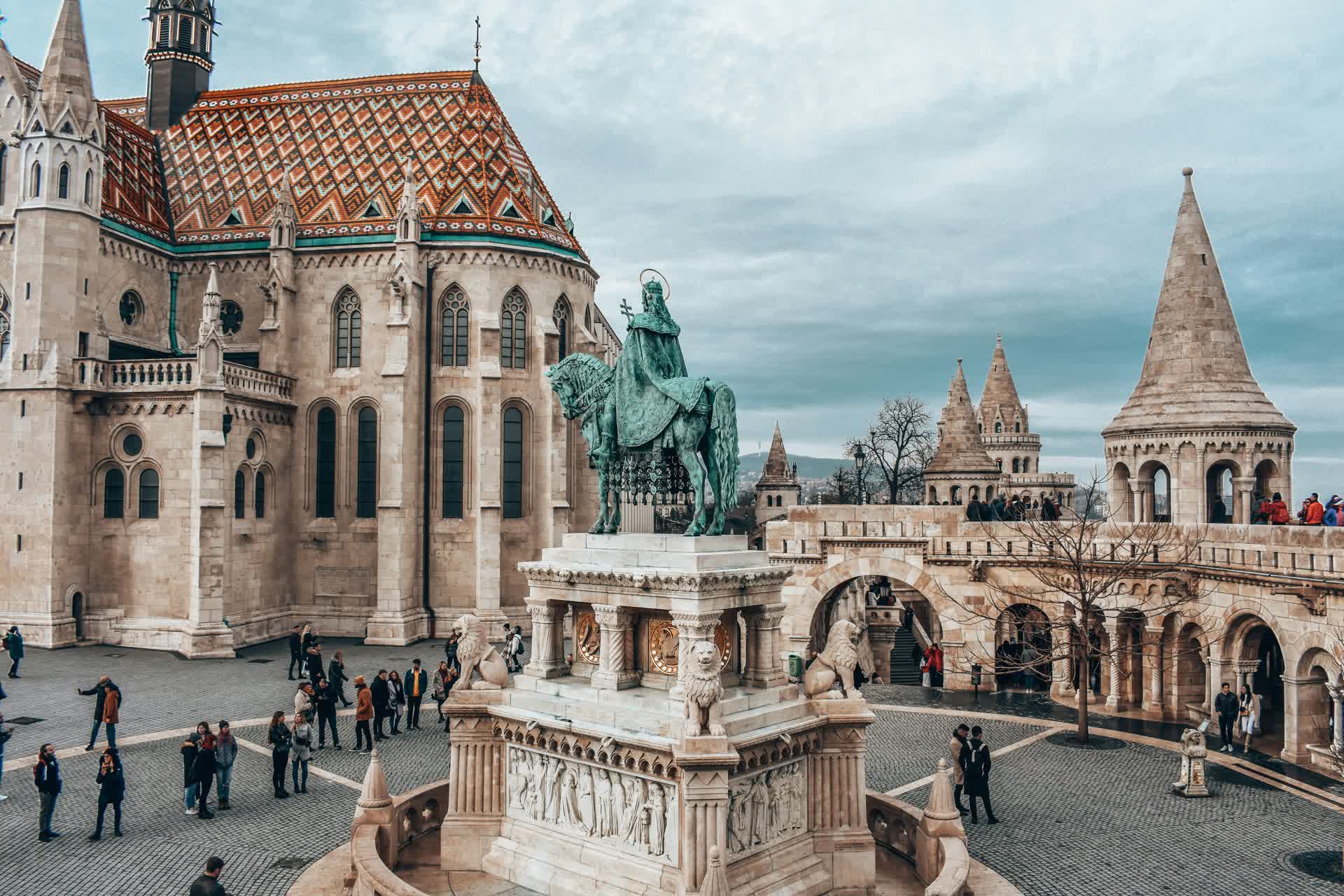 The white neo-Romanesque turrets of Fisherman's Bastion overlooking Budapest in daytime